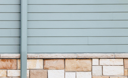 House with blue cladding stone